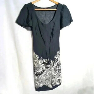 E. Ladies Black with white abstract floral pattern at the bottom sz 18 Romania